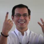 Voter shows inked finger after casting ballot in Philippine elections