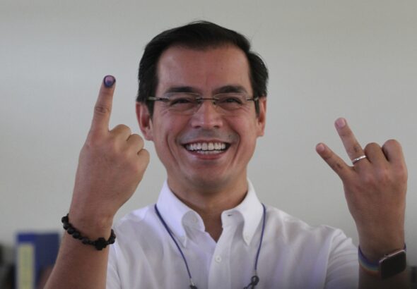 Voter shows inked finger after casting ballot in Philippine elections