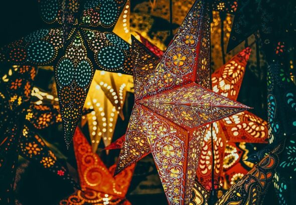 Parol-style star lanterns glowing for the holiday season
