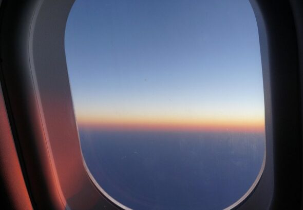 View from an airplane window at sunrise
