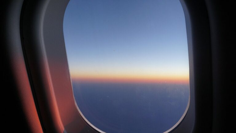 View from an airplane window at sunrise