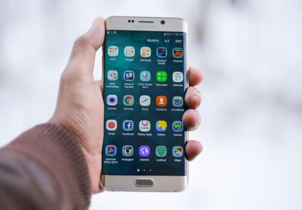 Person holding a smartphone to open a mobile bank account