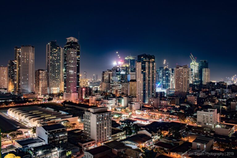 Office towers lit up at night in Ortigas Center, Metro Manila