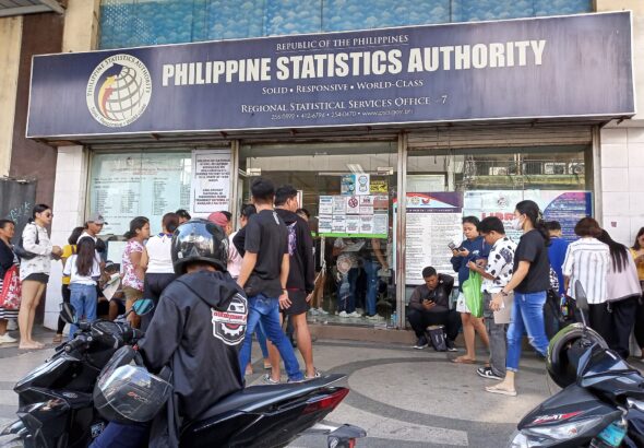 People lining up outside the Philippine Statistics Authority Regional Statistical Services Office VII on Colon Street, Cebu City